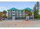 Beachfront condos with white railings, turquoise accents, and stunning ocean views at 24 Gulf Blvd # 1C, Indian Rocks Beach, FL 33785