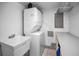 Efficient laundry area with stacked washer and dryer, and ample counter space at 24 Gulf Blvd # 1C, Indian Rocks Beach, FL 33785