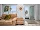 Spacious living room featuring sliding doors leading to a private balcony with beach views at 24 Gulf Blvd # 1C, Indian Rocks Beach, FL 33785