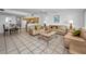 Spacious living room with dining area and kitchen featuring tile floors at 24 Gulf Blvd # 1C, Indian Rocks Beach, FL 33785