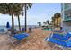 Resort style swimming pool and lounge area adjacent to the beach with lots of lounging chairs available at 24 Gulf Blvd # 1C, Indian Rocks Beach, FL 33785