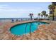 Inviting pool area with lounge chairs and views of the beach at 24 Gulf Blvd # 1C, Indian Rocks Beach, FL 33785