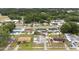 Neighborhood aerial view showing tree coverage and surrounding homes at 2408 Wishing Well Way, Tampa, FL 33619