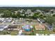 Aerial view displaying a neighborhood with mature trees, quiet streets and tidy homes at 2408 Wishing Well Way, Tampa, FL 33619