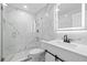 Modern bathroom features a glass-enclosed shower with marble-style walls and contemporary fixtures at 2408 Wishing Well Way, Tampa, FL 33619