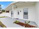 View of a charming home's exterior with manicured garden and welcoming entrance at 2408 Wishing Well Way, Tampa, FL 33619