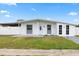 Charming single-story home showcasing a well-maintained lawn and inviting entrance at 2408 Wishing Well Way, Tampa, FL 33619