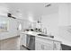 Bright kitchen with stainless steel appliances and a view into the living room at 2408 Wishing Well Way, Tampa, FL 33619