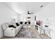 Bright living room with white walls, tile floor, ceiling fan, and sliding glass doors to the exterior at 2408 Wishing Well Way, Tampa, FL 33619