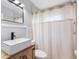 Bathroom featuring black hardware, a vessel sink, and a shower at 2432 Keene Park Dr, Largo, FL 33771