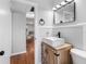 Stylish bathroom features a modern vanity and a vessel sink with a decorative wood cabinet at 2432 Keene Park Dr, Largo, FL 33771
