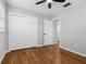 Empty room with beautiful wood laminate flooring, a ceiling fan, and closet at 2432 Keene Park Dr, Largo, FL 33771