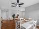 Bright dining area featuring a modern table, contemporary decor and stylish ceiling fan at 2432 Keene Park Dr, Largo, FL 33771
