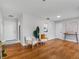 Open-concept living room with hardwood floors, modern furniture, and neutral decor at 2432 Keene Park Dr, Largo, FL 33771