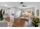 Spacious living room with dining area and hardwood floors, perfect for entertaining at 2432 Keene Park Dr, Largo, FL 33771