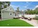 Serene backyard featuring a well-manicured lawn, stone patio, and comfortable outdoor seating area at 2439 6Th N Ave, St Petersburg, FL 33713