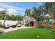 Inviting backyard with lush greenery, a cozy patio, and comfortable outdoor seating, perfect for entertaining at 2439 6Th N Ave, St Petersburg, FL 33713