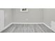 Clean, gray basement with new wood floors and a bright window, perfect for storage or conversion to living space at 2439 6Th N Ave, St Petersburg, FL 33713