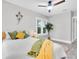 Bright bedroom with a ceiling fan, indoor plant, and a neutral color scheme at 2439 6Th N Ave, St Petersburg, FL 33713
