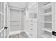 Walk-in closet with custom shelving and drawers for optimal storage at 2439 6Th N Ave, St Petersburg, FL 33713