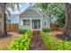 Charming craftsman home features a brick path, manicured landscaping and welcoming front porch at 2439 6Th N Ave, St Petersburg, FL 33713