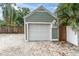 Detached garage with a white garage door and ample space for parking and storage at 2439 6Th N Ave, St Petersburg, FL 33713