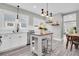 Modern kitchen features white cabinetry, stainless appliances, and a central island at 2439 6Th N Ave, St Petersburg, FL 33713