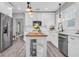 Well-appointed kitchen with stainless steel appliances, central island, and bright lighting at 2439 6Th N Ave, St Petersburg, FL 33713