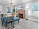 Bright living room boasts a brick fireplace, modern lighting, and large windows at 2439 6Th N Ave, St Petersburg, FL 33713
