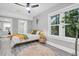 Comfortable bedroom featuring large windows, neutral paint, ceiling fan and closet at 2439 6Th N Ave, St Petersburg, FL 33713