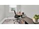 Home office with a modern adjustable desk and sleek rolling chair at 2439 6Th N Ave, St Petersburg, FL 33713