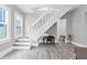 Bright foyer with a modern staircase and versatile living space at 2439 6Th N Ave, St Petersburg, FL 33713