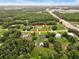 Beautiful home nestled on large lot bordered by mature trees offering a serene and private setting at 25555 Oaks Blvd, Land O Lakes, FL 34639