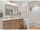 Bright bathroom with modern vanity, stylish fixtures, and a fully tiled shower, creating a spa-like retreat at 25555 Oaks Blvd, Land O Lakes, FL 34639