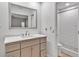 Clean, renovated bathroom with modern fixtures, neutral vanity, and a subway-tiled shower offering style and function at 25555 Oaks Blvd, Land O Lakes, FL 34639