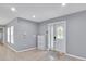 A welcoming entryway featuring tile floors, a decorative glass door, and neutral paint at 25555 Oaks Blvd, Land O Lakes, FL 34639