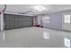 Spacious garage with epoxy floor and storage at 25555 Oaks Blvd, Land O Lakes, FL 34639
