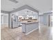 Spacious kitchen with an island, stainless steel appliances and stylish pendant lighting at 25555 Oaks Blvd, Land O Lakes, FL 34639