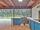 Outdoor kitchen with cabinets and a sink at 25555 Oaks Blvd, Land O Lakes, FL 34639
