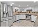 Beautiful kitchen with stainless steel appliances, granite countertops, custom cabinets, and tile backsplash at 25555 Oaks Blvd, Land O Lakes, FL 34639