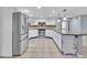 Bright kitchen featuring granite counters, stainless steel appliances, tile backsplash, and white cabinets at 25555 Oaks Blvd, Land O Lakes, FL 34639