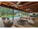 Screened in patio with seating and pool at 25555 Oaks Blvd, Land O Lakes, FL 34639