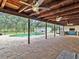 An inviting screened-in pool with a brick paver patio at 25555 Oaks Blvd, Land O Lakes, FL 34639