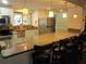 Updated kitchen boasts a large island with granite countertops and stainless-steel appliances at 2616 Cove Cay Dr # 104, Clearwater, FL 33760