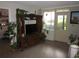Bright living room featuring a large entertainment center and natural light at 2616 Cove Cay Dr # 104, Clearwater, FL 33760