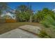 A spacious backyard featuring green foliage and a paver patio, perfect for outdoor entertaining at 2931 23Rd N St, St Petersburg, FL 33713