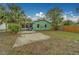 View of the home's backyard featuring a carport, paver patio and mature trees at 2931 23Rd N St, St Petersburg, FL 33713