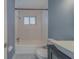 Bright bathroom with a bathtub, white tile surround, and a modern vessel sink at 2931 23Rd N St, St Petersburg, FL 33713