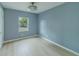 Serene bedroom featuring neutral paint, hardwood floors, and a view of the outdoors at 2931 23Rd N St, St Petersburg, FL 33713
