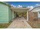 The carport area has a concrete floor and provides access to the backyard at 2931 23Rd N St, St Petersburg, FL 33713